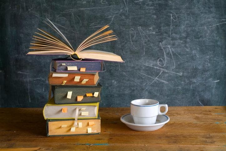 A pile of books and a cup of tea