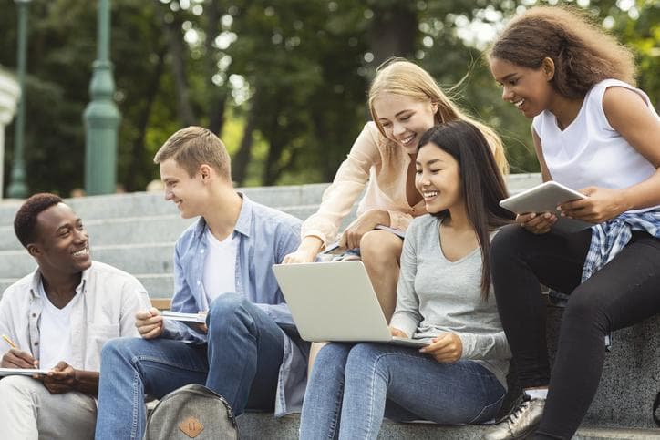 Group of students completing a project at university