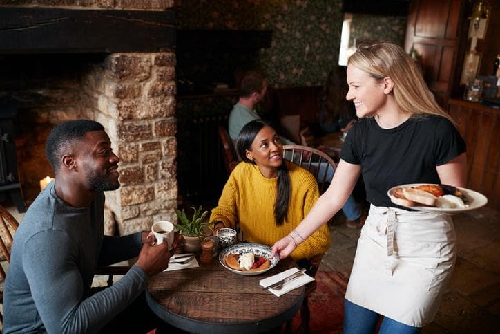 Waitress with customers