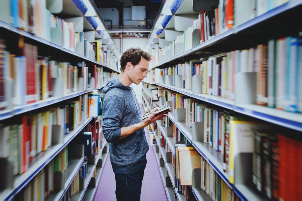 student in library